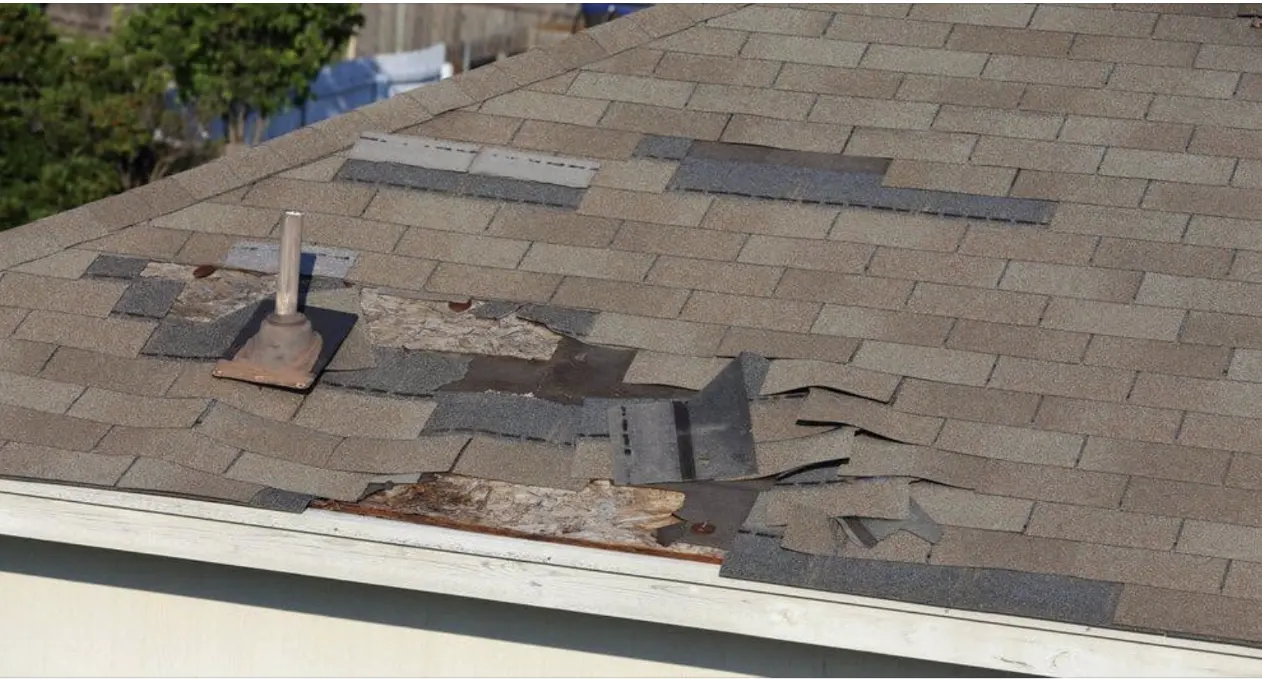 Wind-damaged roof repair performed by our expert Bismarck Roofing Company.